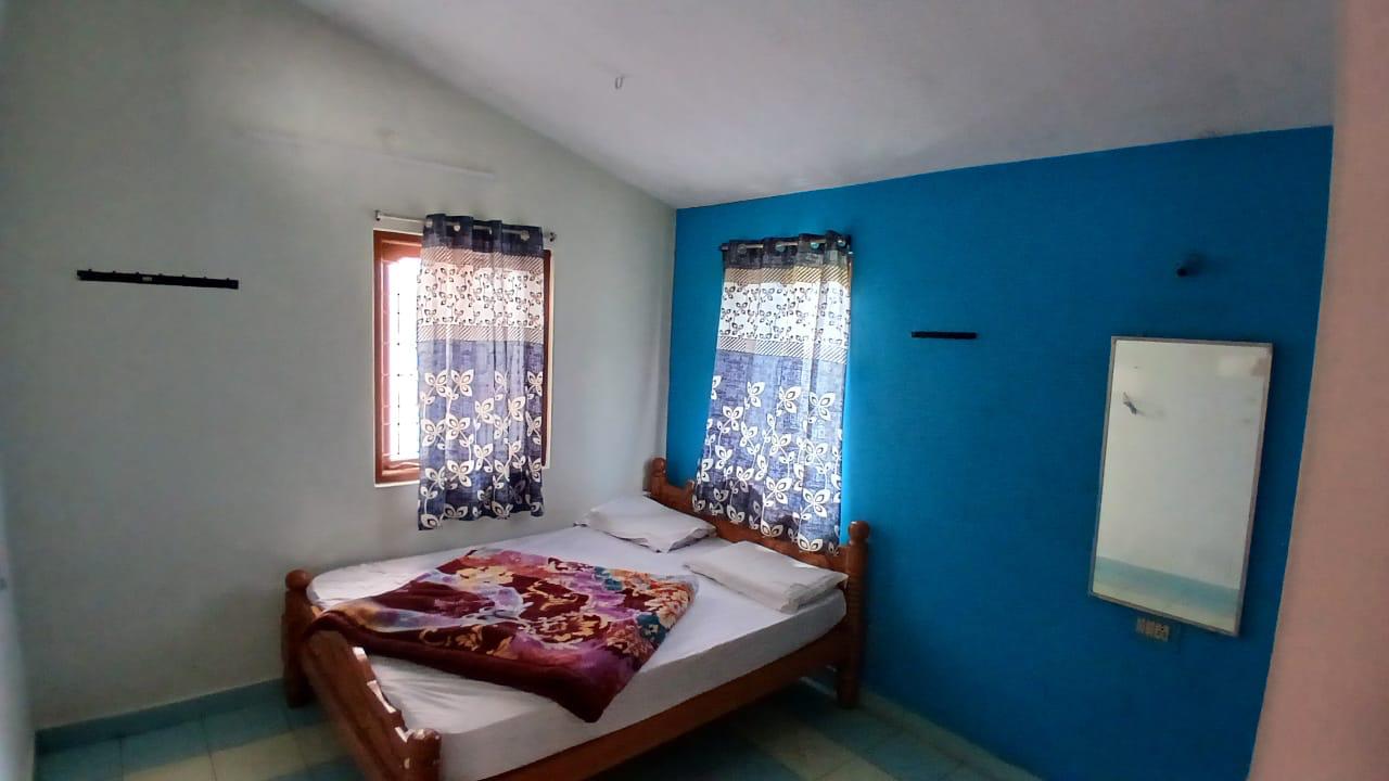 Bedroom with blue accent wall