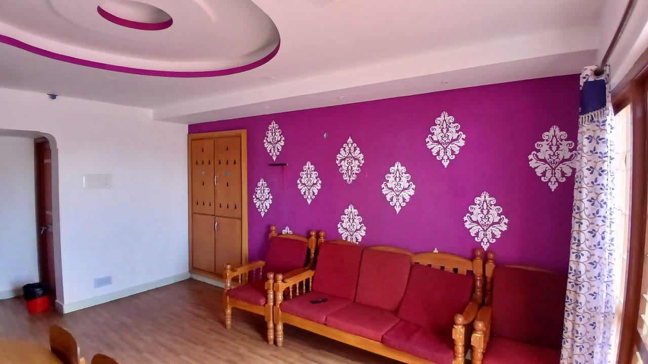 Living area with purple accent wall